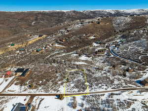 Snowy aerial view with a mountain view