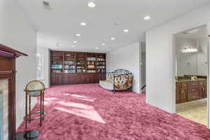 Sitting room with baseboards, visible vents, carpet flooring, and recessed lighting