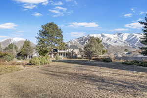 Back of property with a mountain view