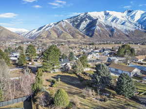 Property view of mountains with a residential view