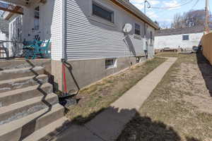 View of property exterior featuring fence