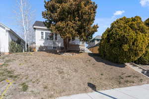 Exterior space with a shingled roof