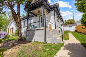 View of property exterior featuring fence