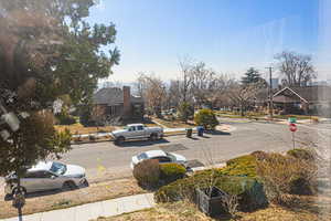 View of road with curbs, traffic signs, and sidewalks