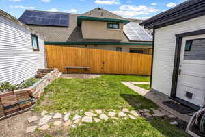 View of yard featuring fence