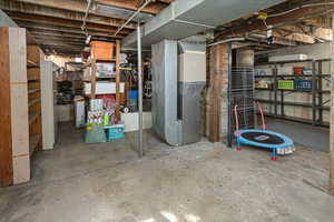 Unfinished basement with heating unit