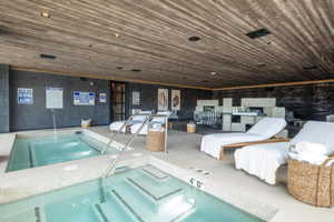 Pool featuring an indoor hot tub