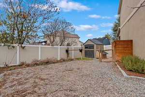 View of yard with an outbuilding and a fenced backyard