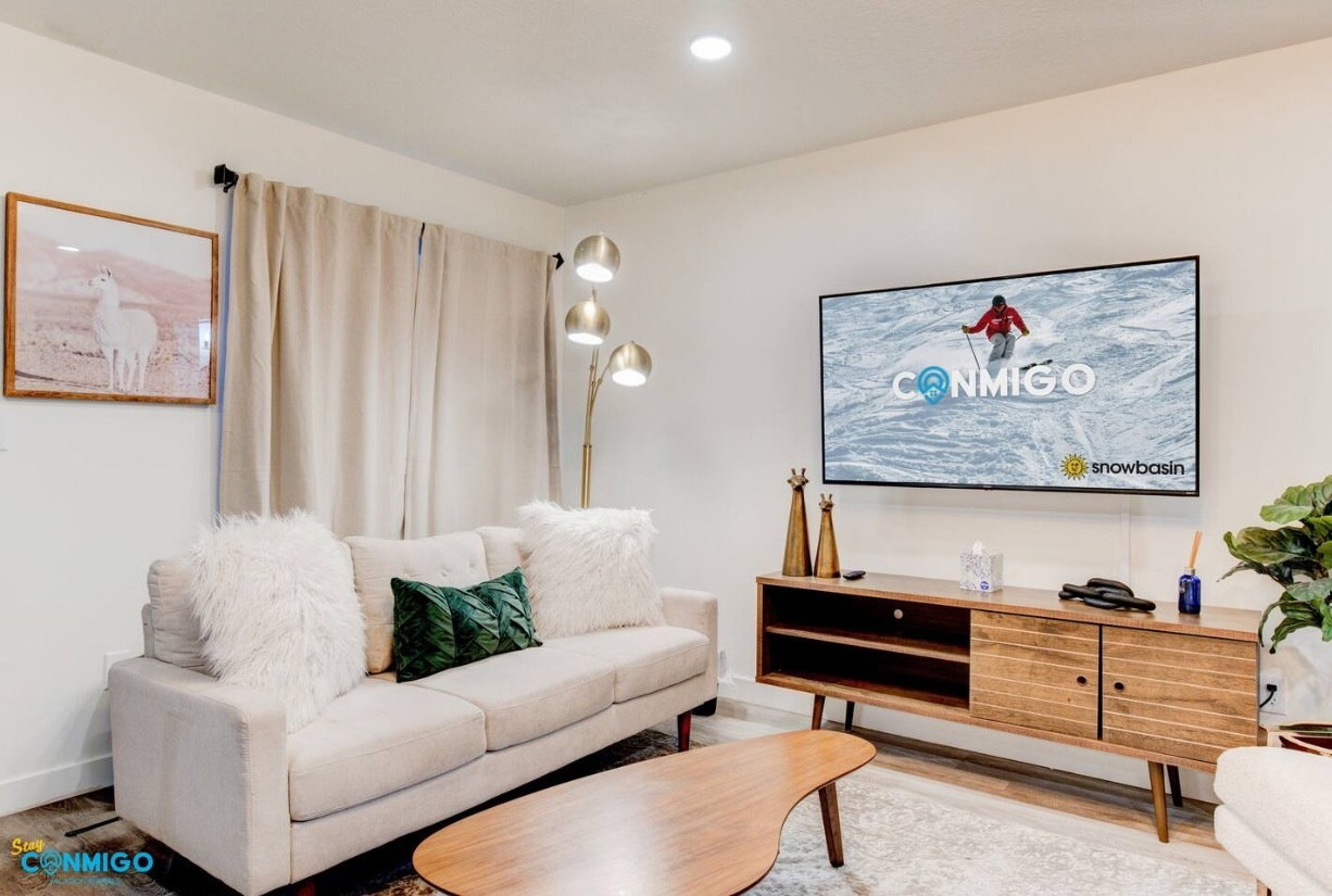 Living room with recessed lighting and wood finished floors