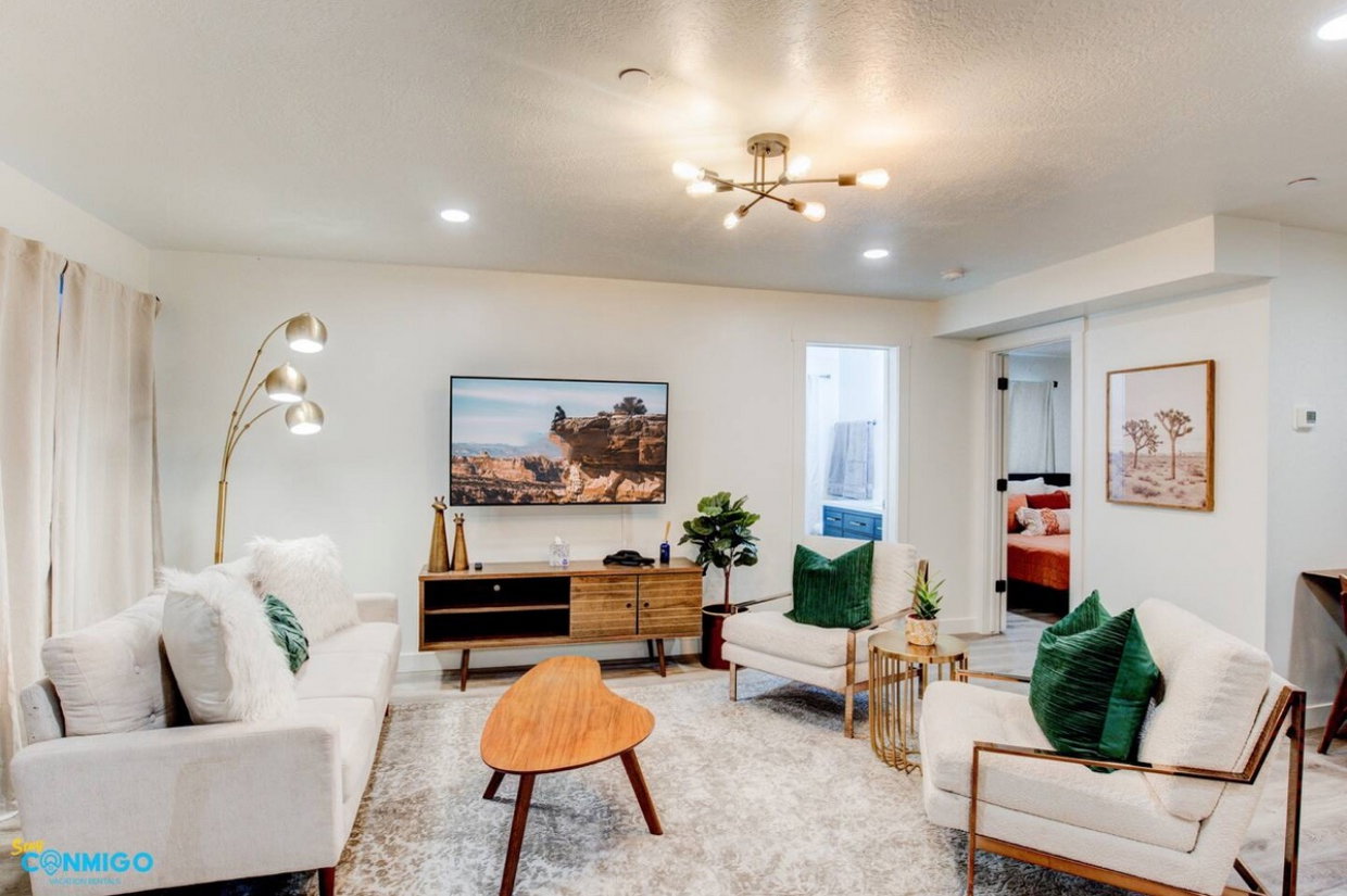 Living room featuring recessed lighting, a textured ceiling, and an inviting chandelier