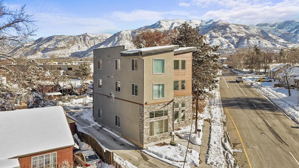 Snow covered property featuring a mountain view