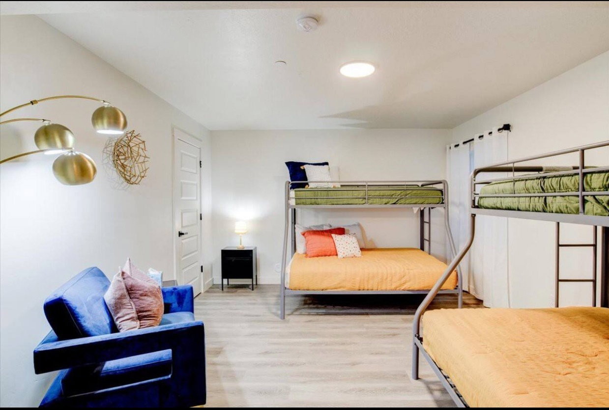 Bedroom featuring baseboards and wood finished floors