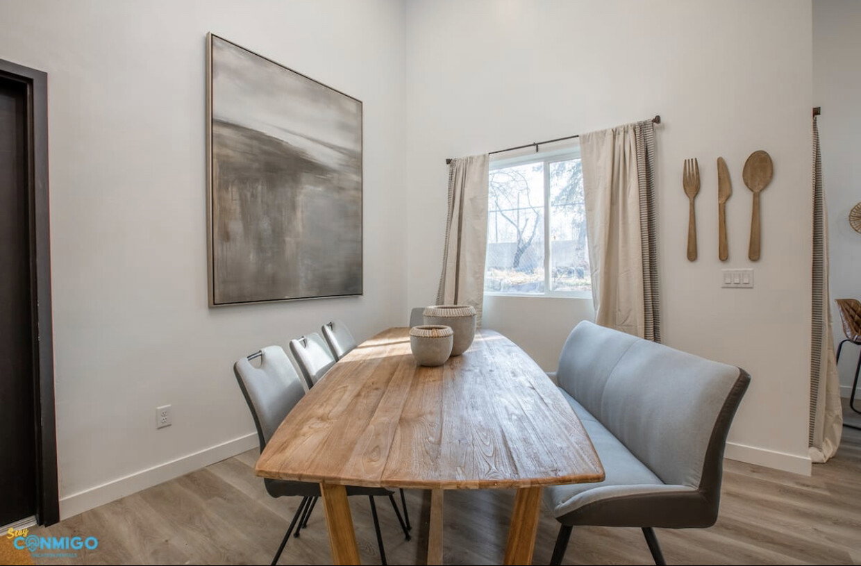 Dining space featuring light wood-style floors and baseboards