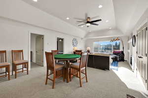 Dining space featuring light colored carpet, recessed lighting, and a ceiling fan