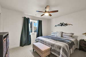 Bedroom featuring carpet flooring and ceiling fan