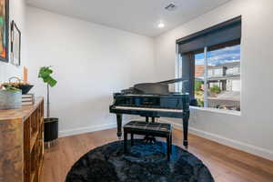 Office featuring large window and recessed lighting.