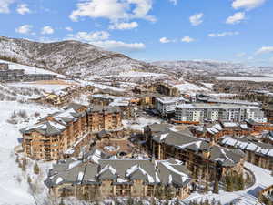 Snowy aerial view with a mountain view