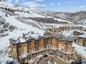 Snowy aerial view with a mountain view