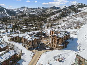 Snowy aerial view featuring a mountain view