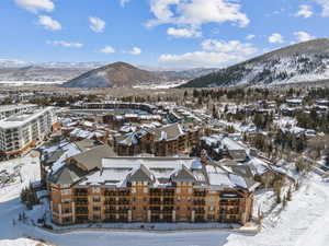 Snowy aerial view featuring a mountain view