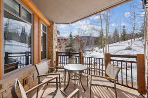 View of snow covered back of property