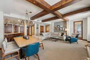 Dining space with recessed lighting, visible vents, light carpet, beamed ceiling, and baseboards