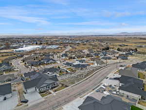 Birds eye view of property with a residential view and a mountain view
