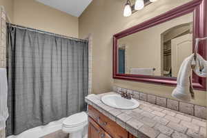 Full bath featuring toilet and vanity