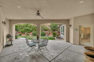 View of patio / terrace featuring ceiling fan, outdoor dining space, and grilling area