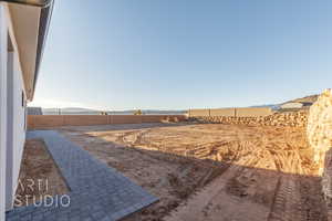 View of yard with fence and a mountain view