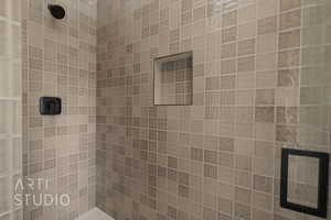 Bathroom featuring tiled shower