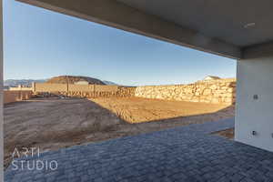 View of yard with a patio area, a mountain view, and a fenced backyard