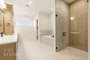 Full bath featuring a stall shower, visible vents, a garden tub, vanity, and recessed lighting