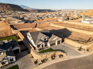 Birds eye view of property with a residential view and a mountain view