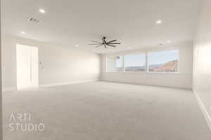 Spare room featuring light carpet, visible vents, and recessed lighting