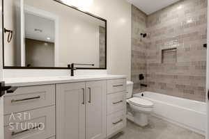 Full bathroom featuring tile patterned flooring, toilet, visible vents, vanity, and  shower combination