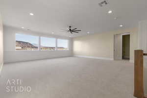 Unfurnished room featuring ceiling fan, recessed lighting, light colored carpet, visible vents, and baseboards