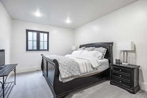 Carpeted bedroom featuring baseboards