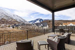 View of patio featuring a fenced backyard, a mountain view, and an outdoor hangout area