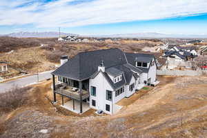 Birds eye view of property with a residential view and a mountain view