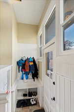 Mudroom featuring wainscoting