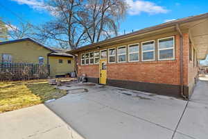 View of front of home featuring brick siding and a front lawn