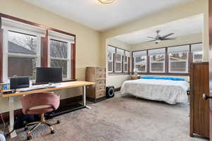 Carpeted bedroom featuring baseboards