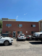 Exterior space featuring brick siding