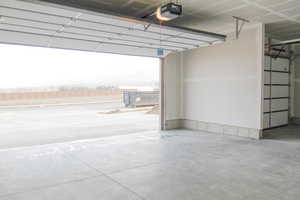 Garage featuring a garage door opener