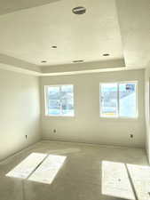 Spare room featuring visible vents and a textured ceiling