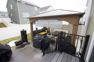 View of patio featuring grilling area and a fenced backyard