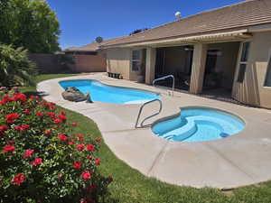 View of swimming pool with a fenced backyard and a patio