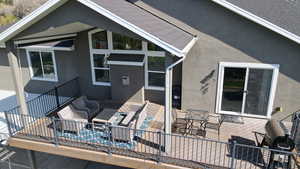 Back of property featuring stucco siding