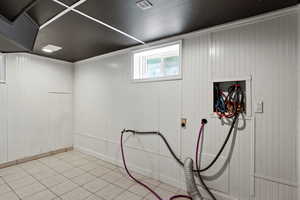 Basement featuring baseboards
